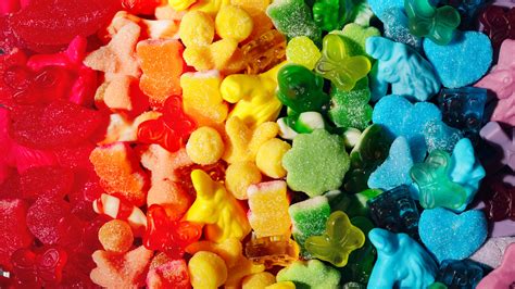 I stocked up on those, plus some gummies in the shape of vampire teeth, gummy Coke bottles; a scoopful of delicate little marshmallows that looked like pink-capped mushrooms; and a small selection ...